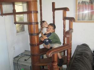 Donny playing with Yirmi on the stairs